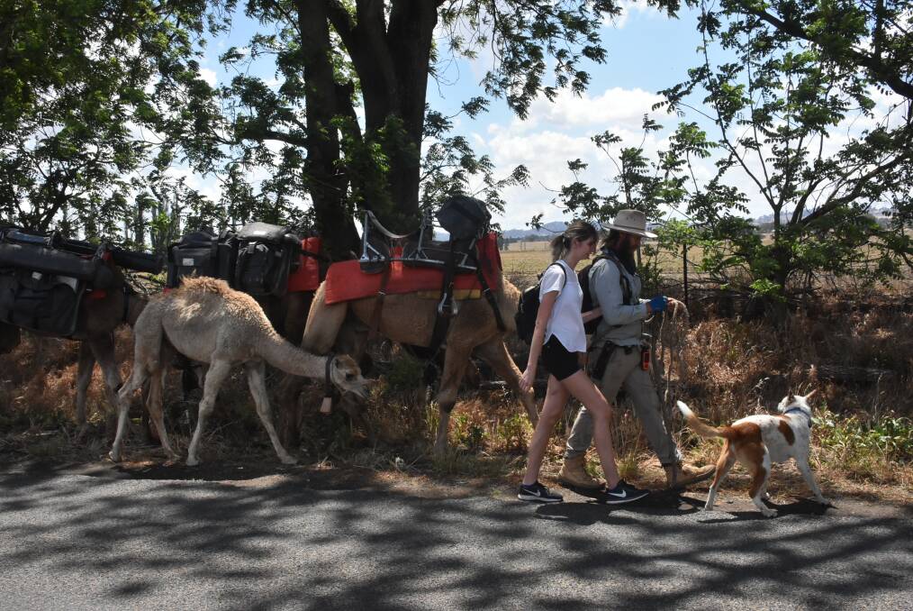 John Elliott on the road with his partner Jess, dog Bruski and camels.
