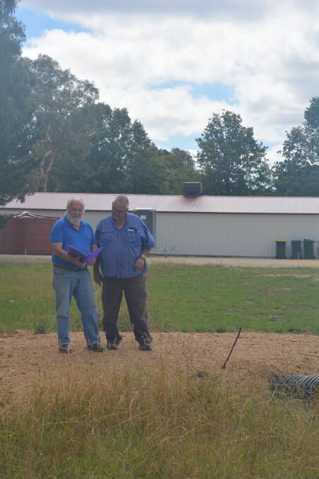 David Evans and Trevor Marchant inspecting the Community Garden site where a water feature will be established.