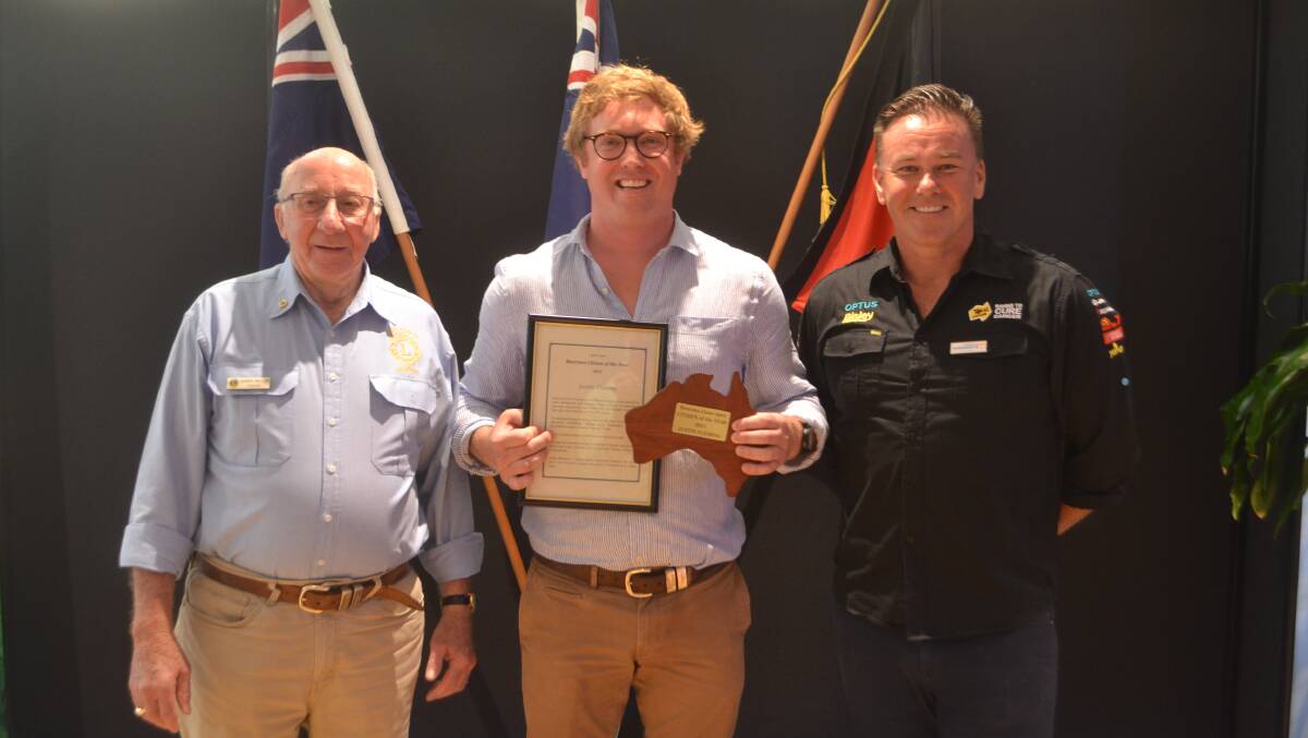 Justin Fleming (centre) receiving the Lions/Apex Citizen of the Year Award from Barry Miller, Lions Club (left) and Ambassador Geoff Coombes (right).