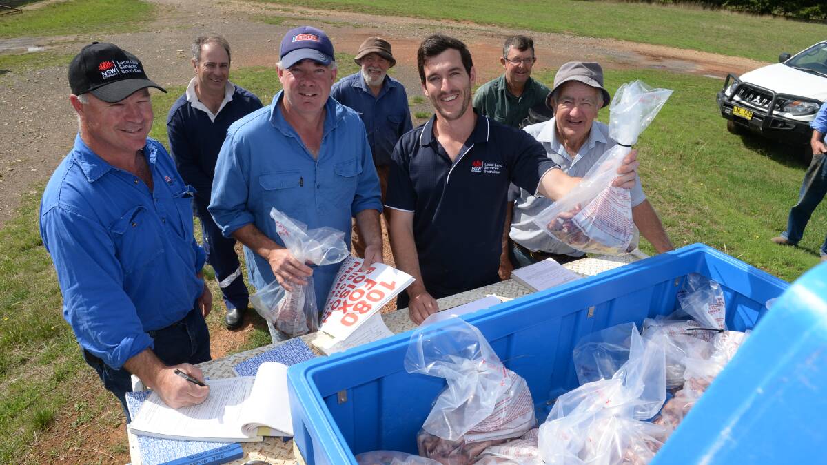 LLS biosecurity officers dropping baits off to Feral Fighter members.