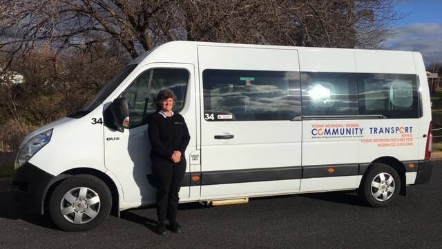  Alarna Sims with one of the Community Transport buses. 