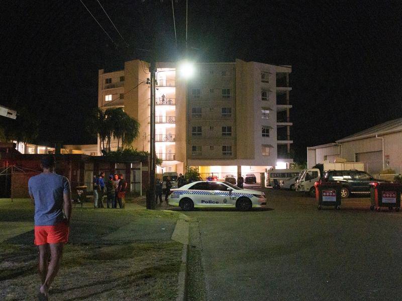 A man has told of his girlfriend's legs being shot as he shielded her in Darwin's Palms Motel.