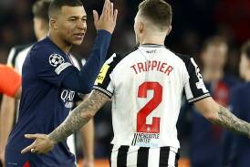Kylian Mbappe argues with Newcastle's Kieran Trippier after PSG were awarded a debatable penalty. (EPA PHOTO)