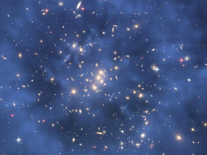 Dark matter is hard to locate because it doesn't absorb, reflect or emit light.