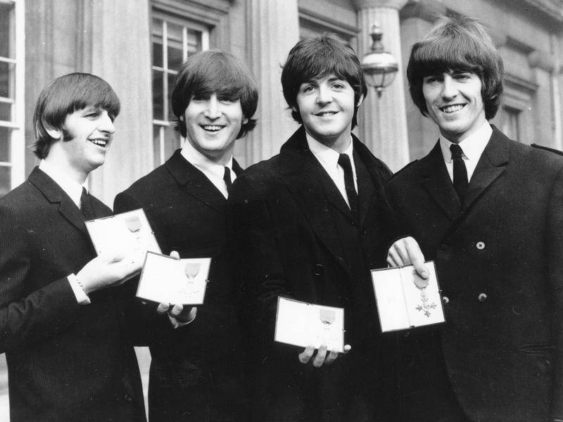 Paul McCartney says The Beatles' manager asked the band members to keep quiet after the break-up.
