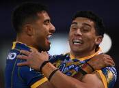 Bailey Simonsson (right) celebrates after scoring a try during Parramatta's win at Canberra.