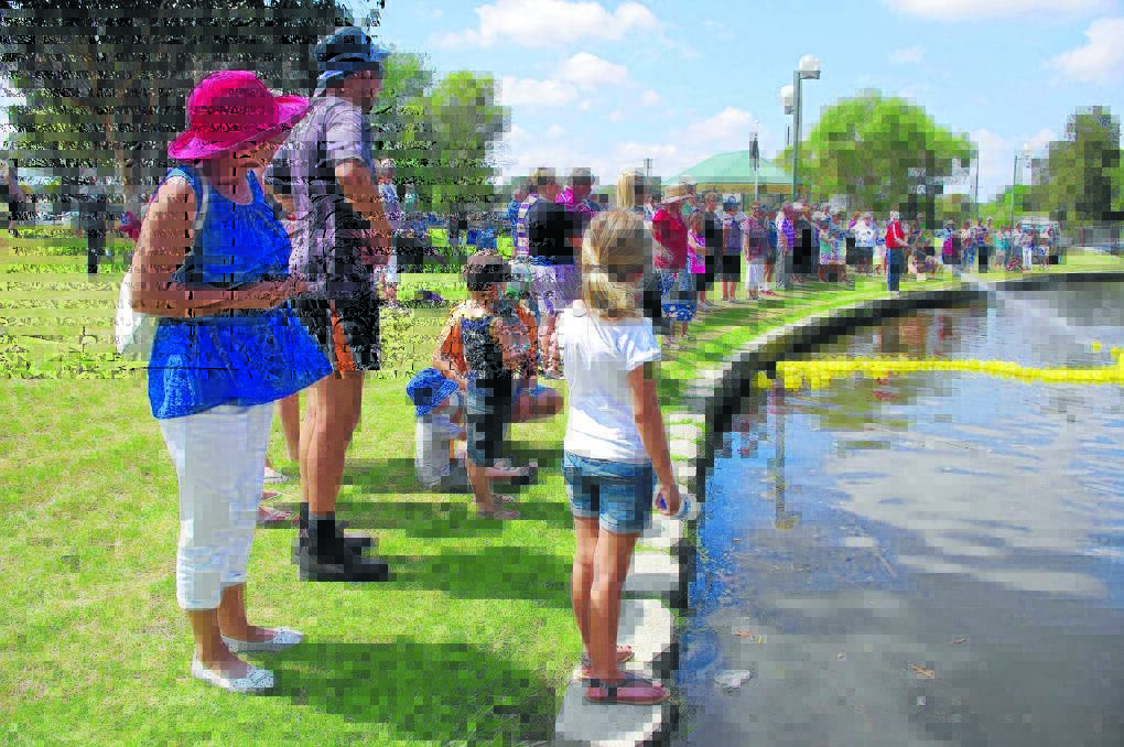 AUSTRALIA DAY DUCK RACE: The crowd watches on as Boorowa Rotary commences the Rubber Duck Races.