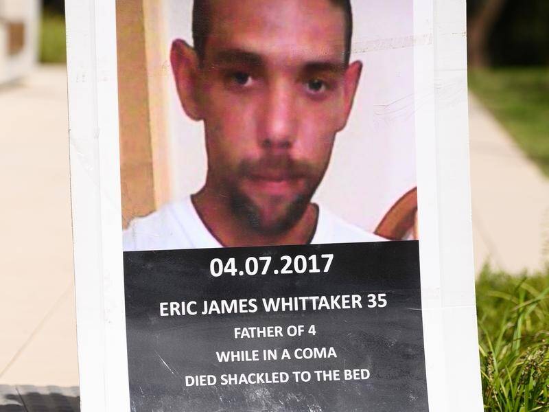 Eric Whittaker was unconscious and shackled to a bed prior to his death from a brain haemorrhage.