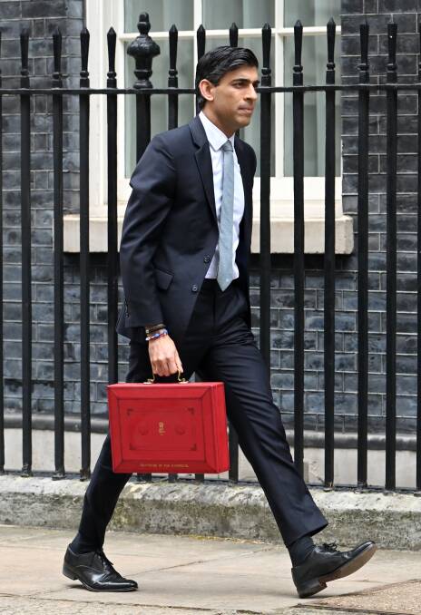 UK Chancellor of the Exchequer Rishi Sunak with the Budget Box. In Britain, tax collections need to be reauthorised every year. Picture: Getty Images