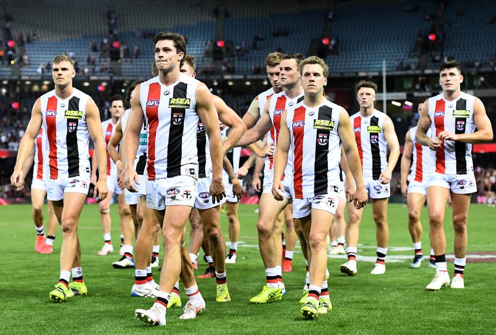LOSS: Jack Steele and his Saints teammates look dejected after losing against Essendon. Photo: Quinn Rooney/Getty Images